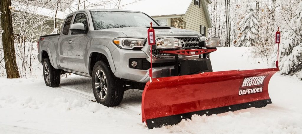 Truck with a Western Defender snowplow by Douglas Dynamics